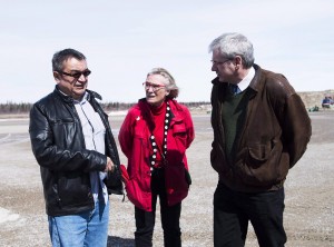 Chief Bruce Shisheesh, left, Minister of Indigenous Affairs Carolyn Bennett, centre, and Federal NDP MPP Charlie Angus, right, meet in the northern Ontario First Nations reserve of Attawapiskat, Ont., in an April 16, 2016, file photo. Two cabinet ministers will speak at the United Nations in New York City today about the government's approach to indigenous affairs, but grave conditions on a northern Ontario reserve have prompted the NDP's indigenous affairs critic to cancel his attendance as part of the Canadian delegation. THE CANADIAN PRESS/Nathan Denette