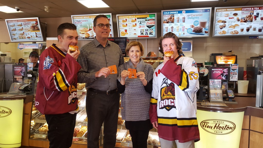 From left: Rock captain Jordan Rendle, Rob Knox and Linda Venneri of Tim Horton's, Rock alternate captain Cory Sprague. (Mark Pare/ROGERS MEDIA)